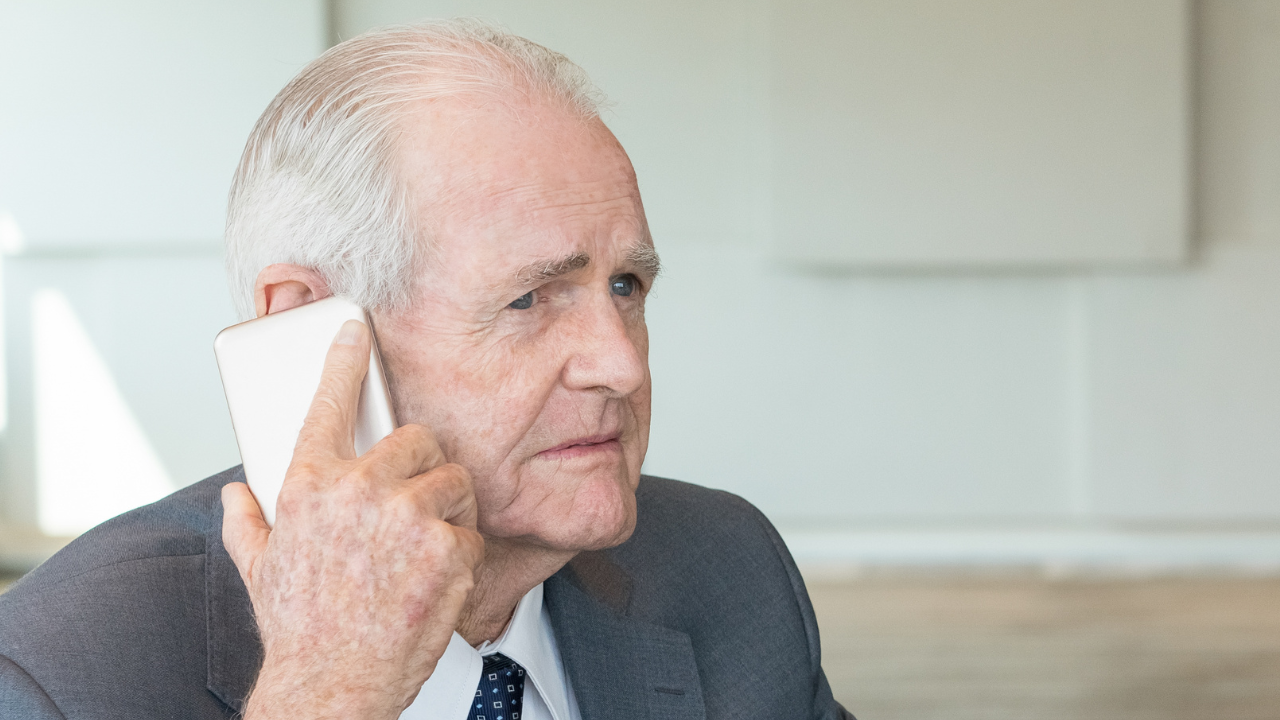 disappointed senior man on the phone,  time to end a friendship