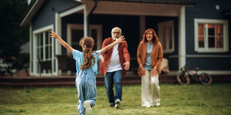 grandparent's house, grandchild running excitedly to grandma and grandpa with arms wide open