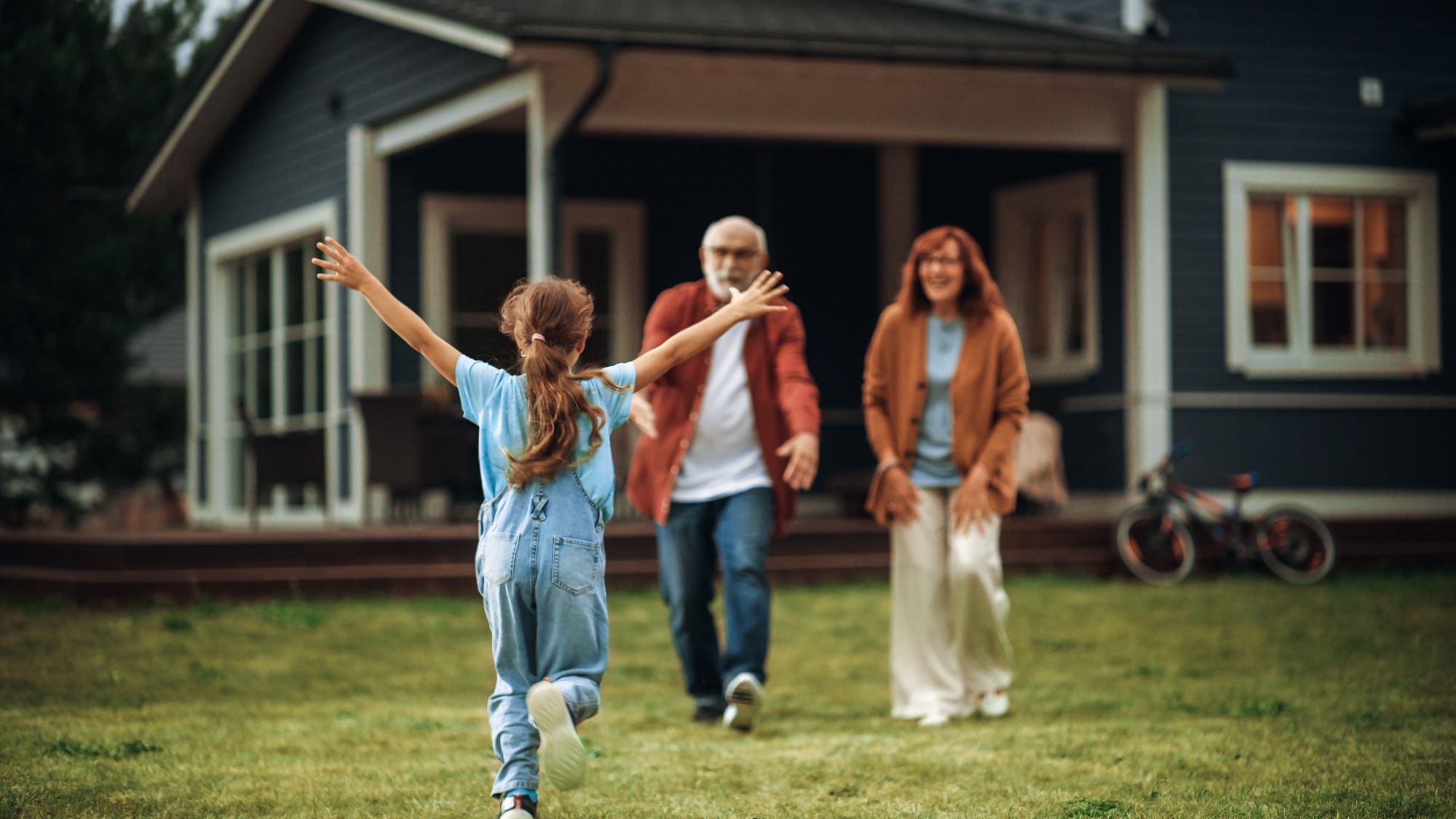 grandparent's house, grandchild running excitedly to grandma and grandpa with arms wide open