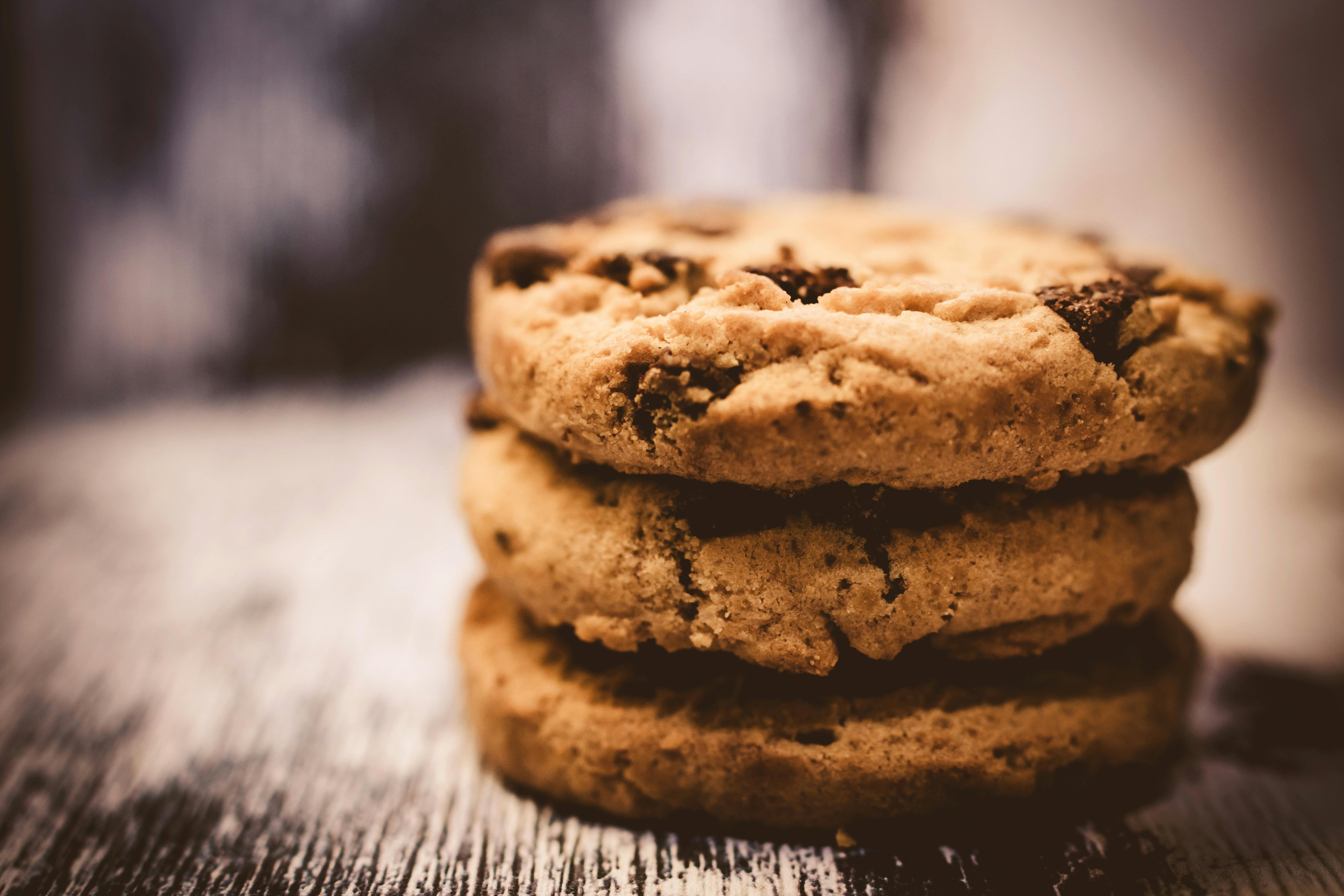 chocolate chip cookies, stacked on the table