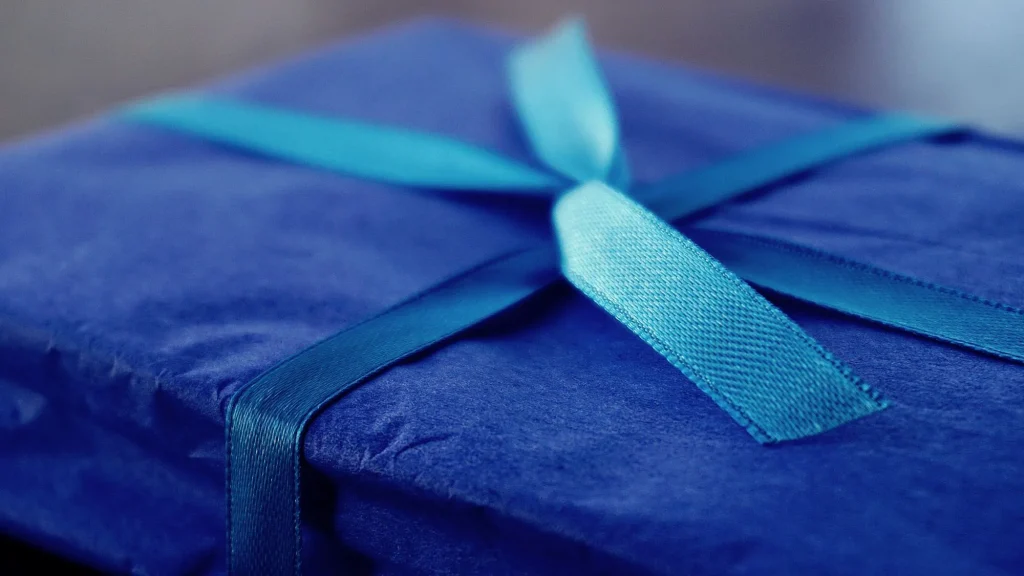 blue gift box with blue ribbon close up