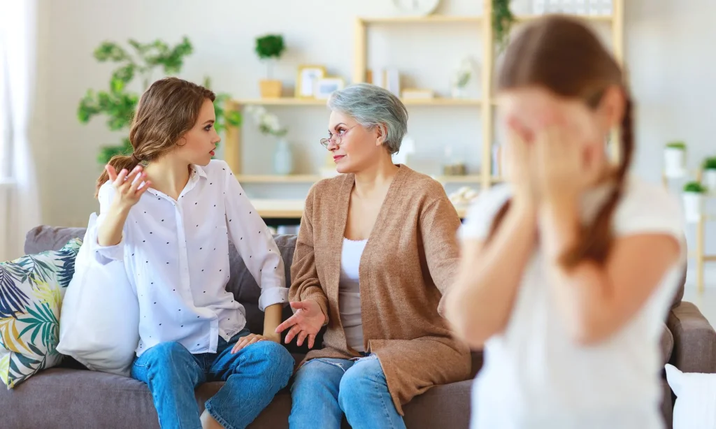 conflict of family three generations angry mother and grandmother scolding a naughty child