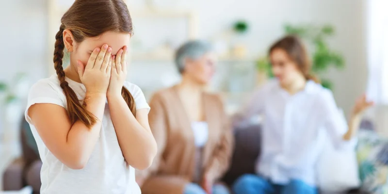 conflict of family three generations angry mother and grandmother scolding a naughty child, grandchild feelings hurt