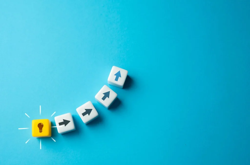 make a plan idea boxes on a blue background Start moving from idea to implementation. Ingenuity and creativity. Eureka moment. Spark of genius that fuels innovation and propels individuals forward on their quest to make a difference.