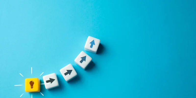 make a plan idea boxes on a blue background Start moving from idea to implementation. Ingenuity and creativity. Eureka moment. Spark of genius that fuels innovation and propels individuals forward on their quest to make a difference.