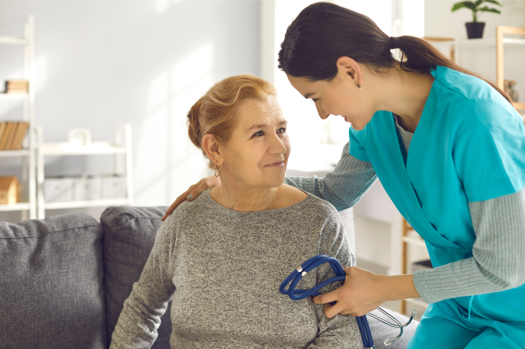 nurse with an older lady patient