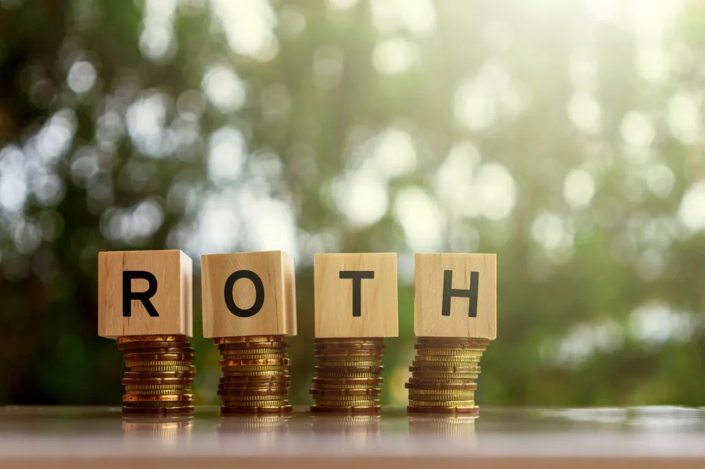Wooden blocks with text ROTH. Business and finance concept