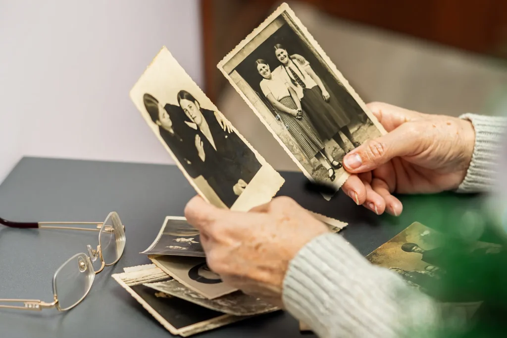 hands looking at old photos