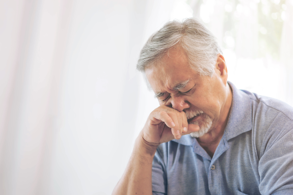 crying asain senior adult man