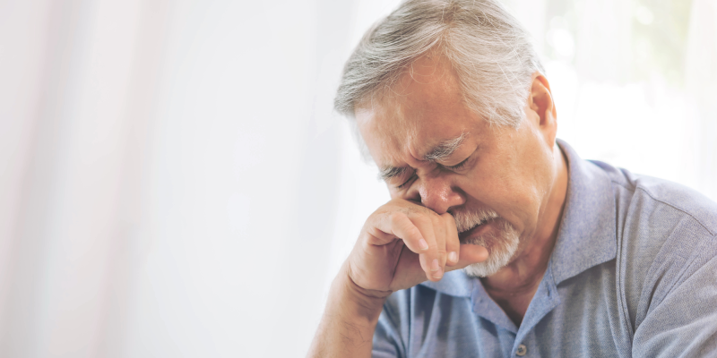 crying asain senior adult man