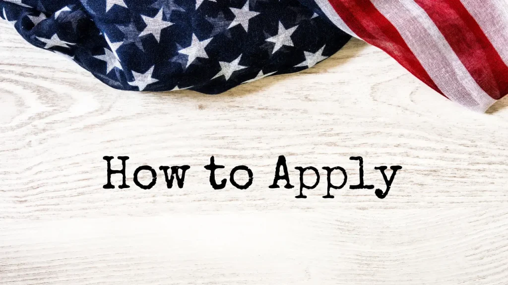How to Apply written by typewriter on wooden background with an American flag at the top of the photo