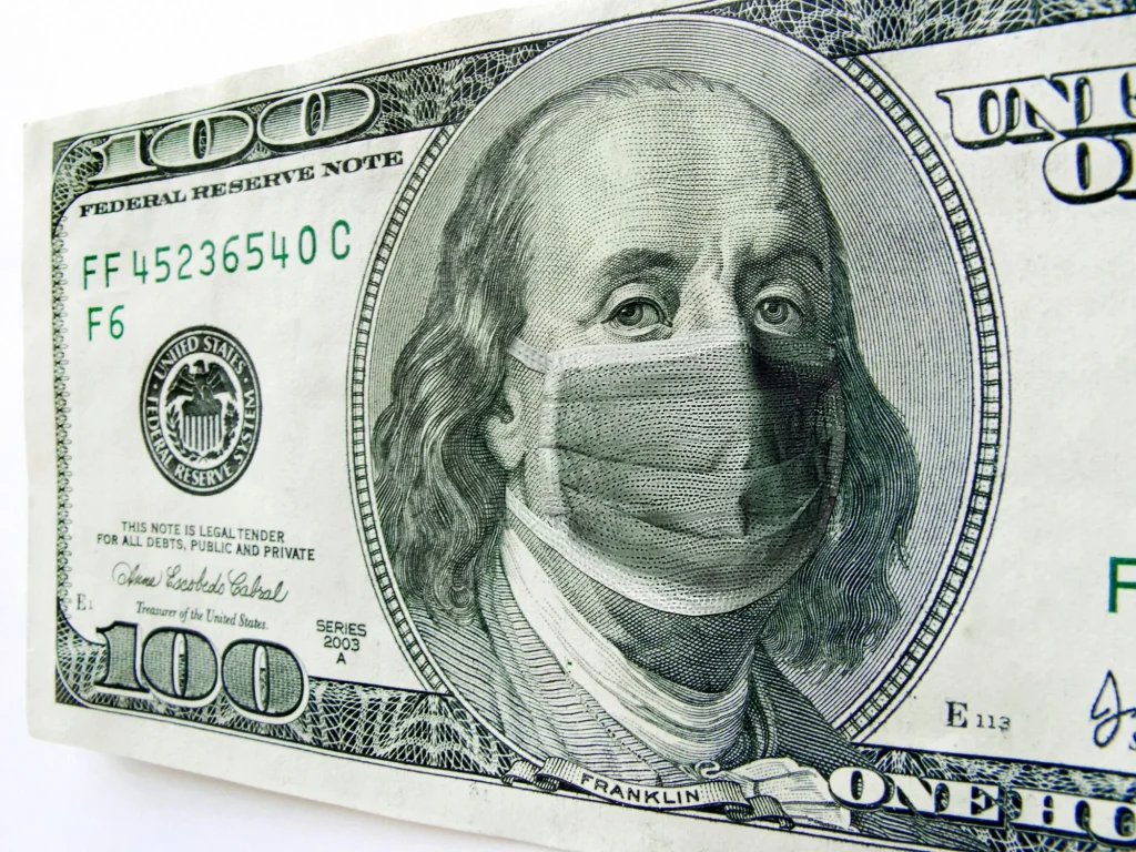 photo illustration of Ben Franklin wearing a healthcare surgical mask on a one hundred dollar bill