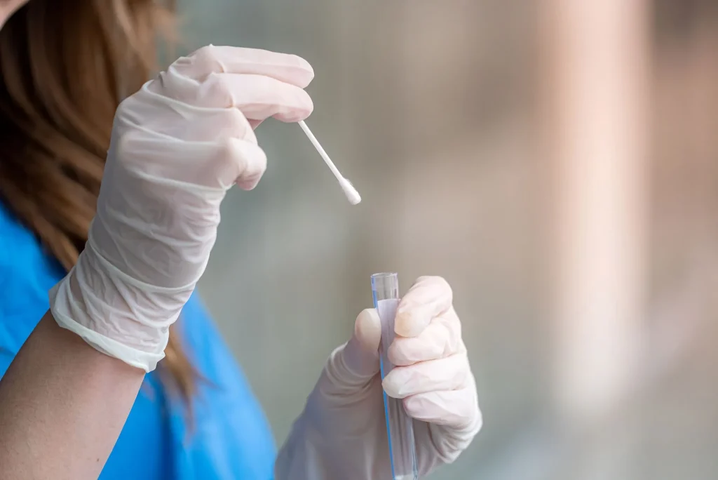 close up of a nurse holding a lab test