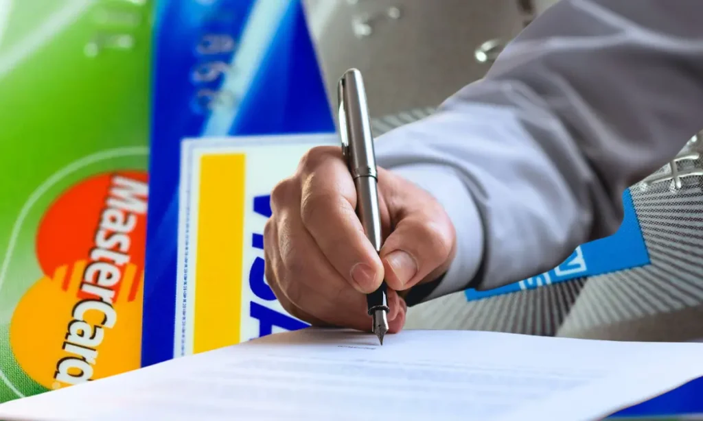 signing for credit cards, large credit card background