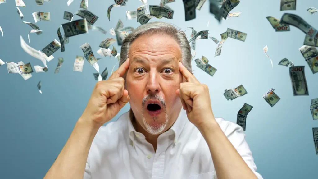senior or retired man making smart money moves, blue background with money floating around
