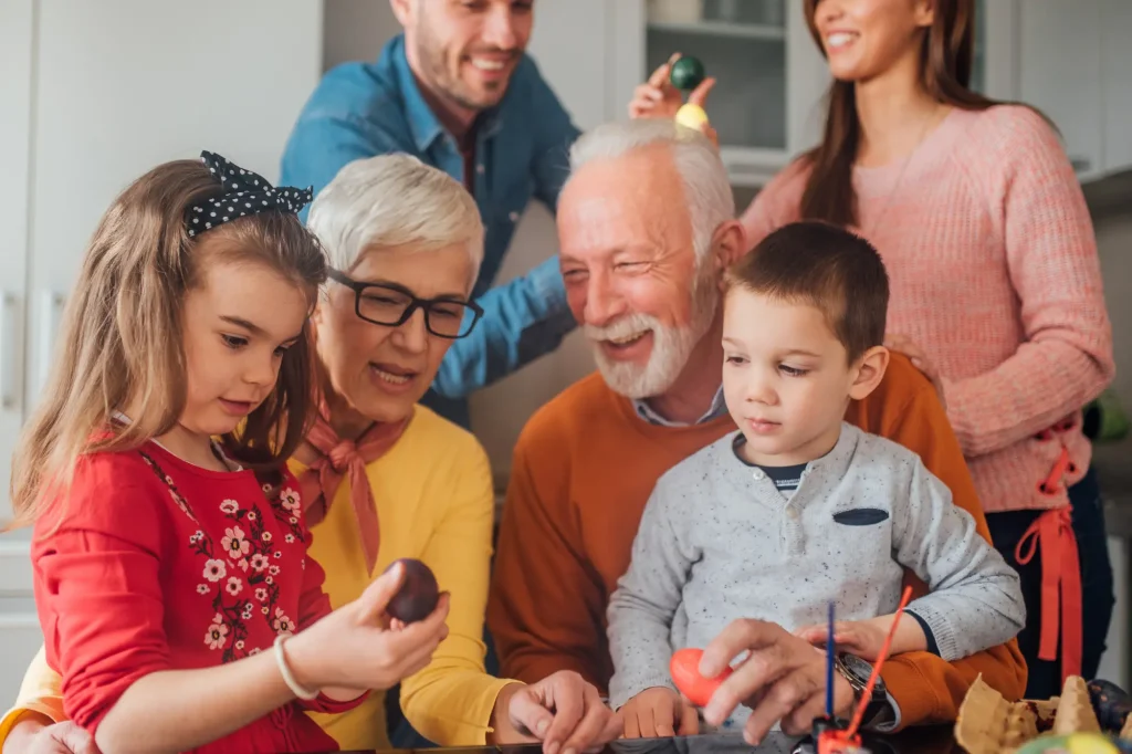 grandparents with daughter, son-in-law, and grandkids, spending time together