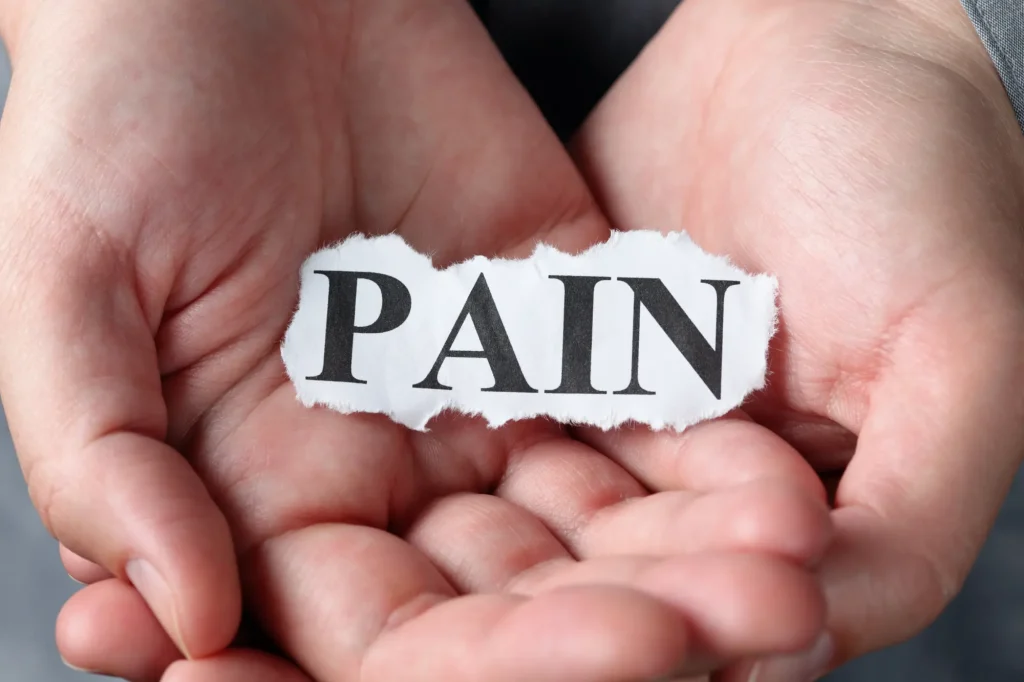 hand holding a pain paper