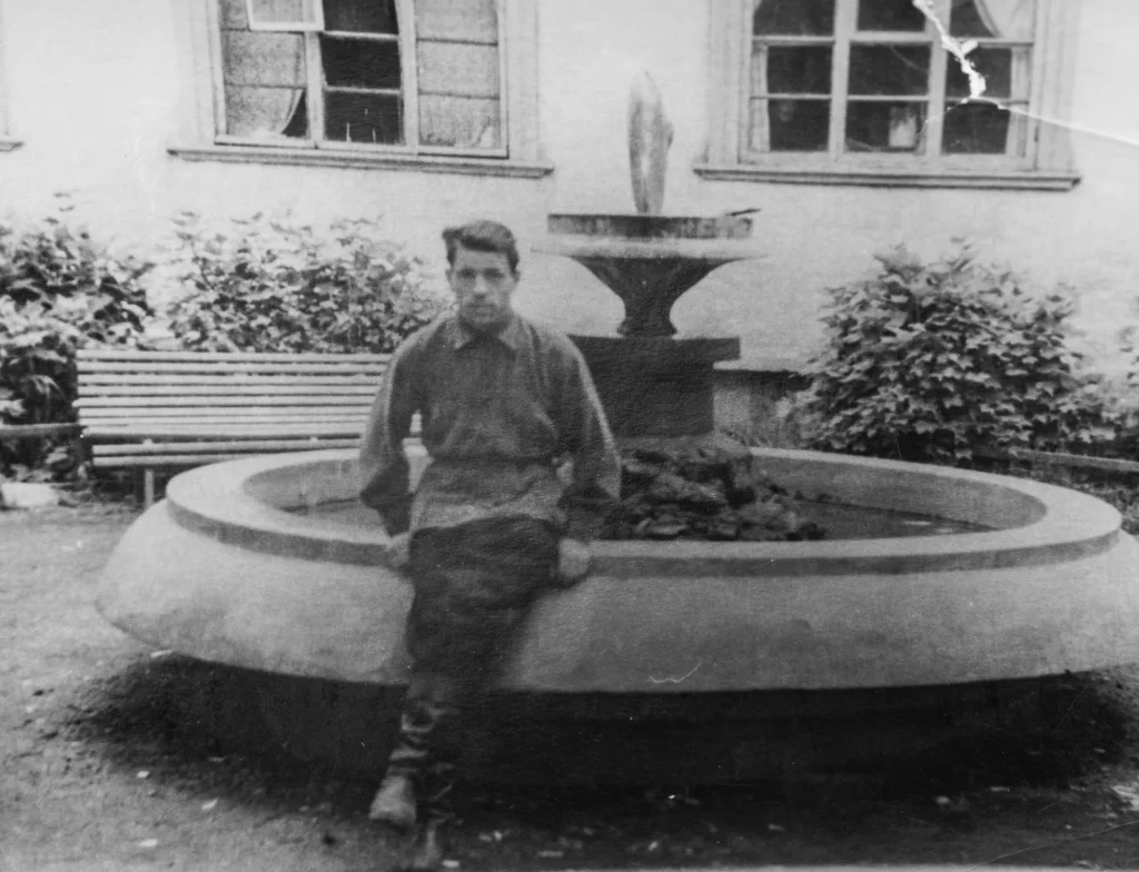 man sitting on fountain, vintage photo