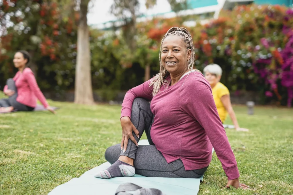 Multiracial women doing yoga exercise with social distance for - Healthy lifestyle and sport concept