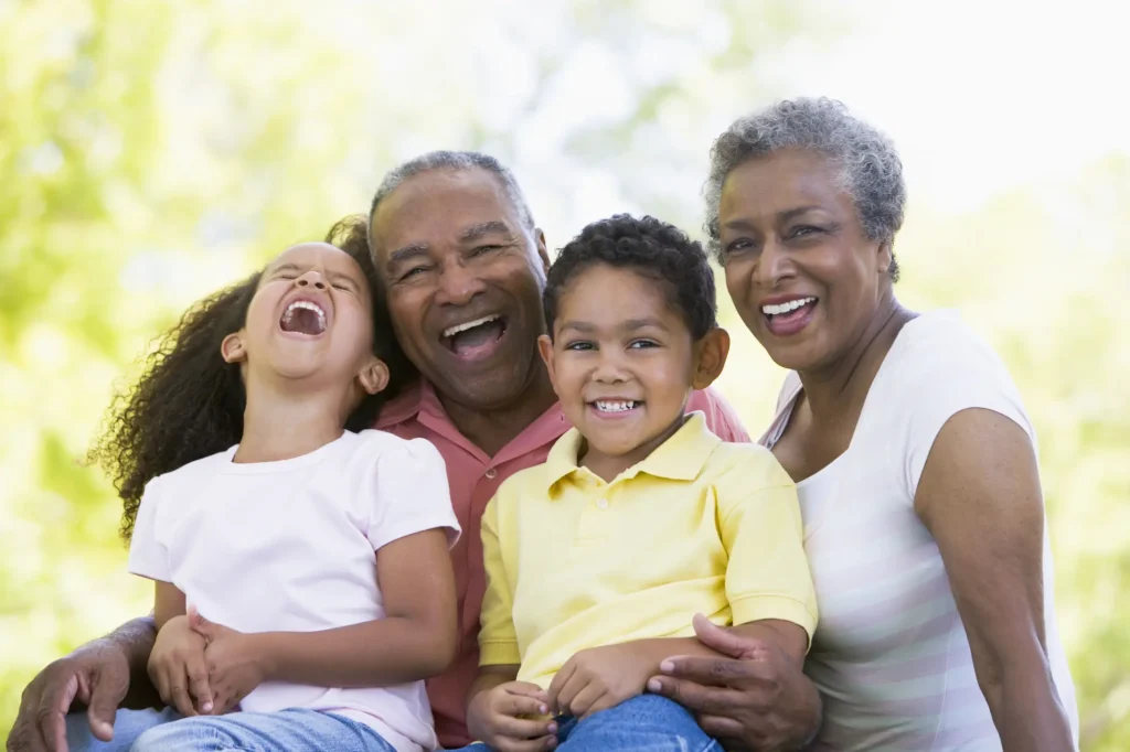 grandparents laughing with grandkids