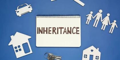 notebook on blue background with word inheritance