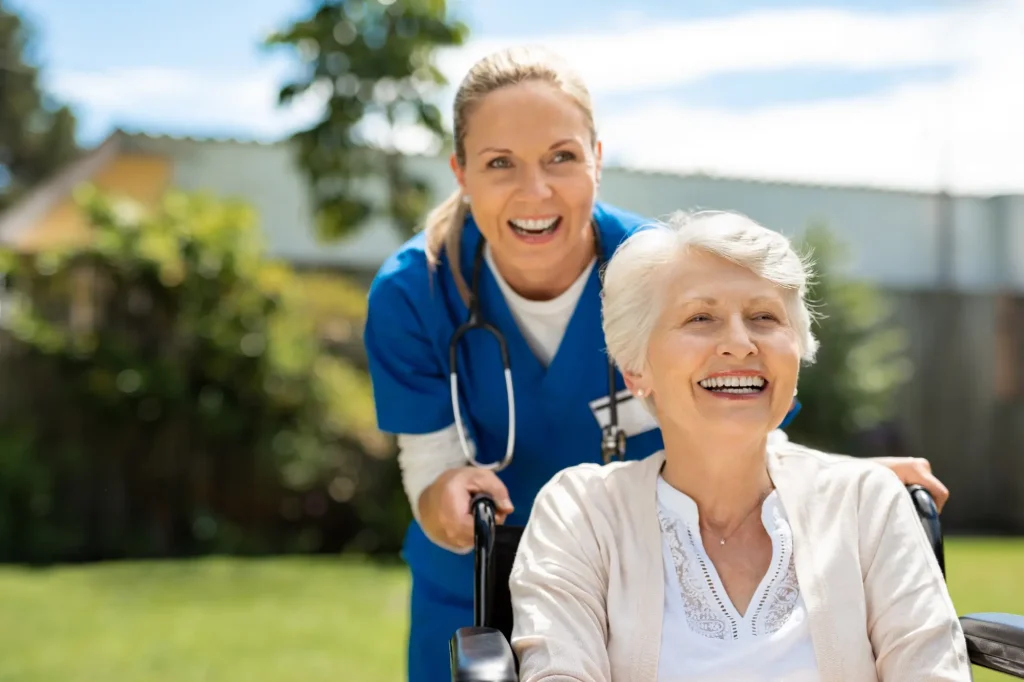 nurse pushing patient in wheelchair