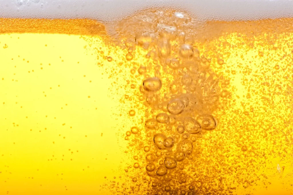 close up photo of bubbles in a glass of beer