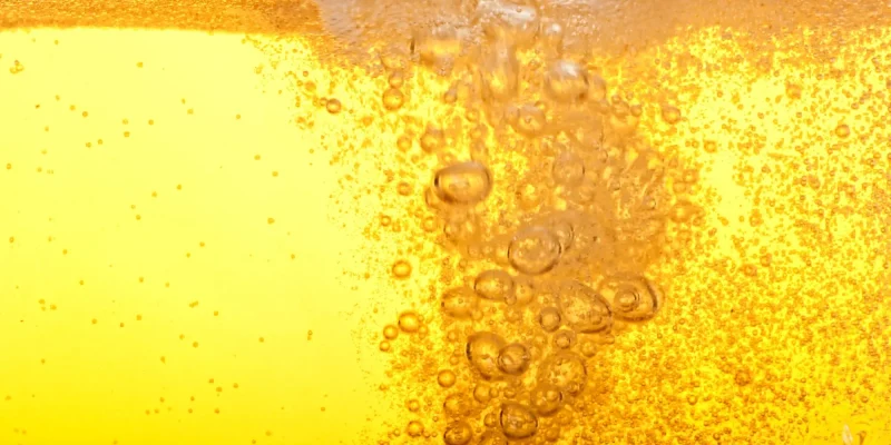 close up photo of bubbles in a glass of beer
