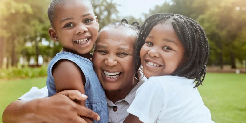 granmother and granddaughters close up and smiling