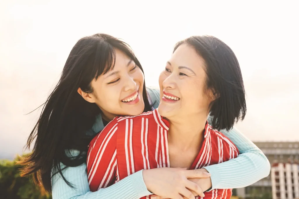 mom and daughter hugging