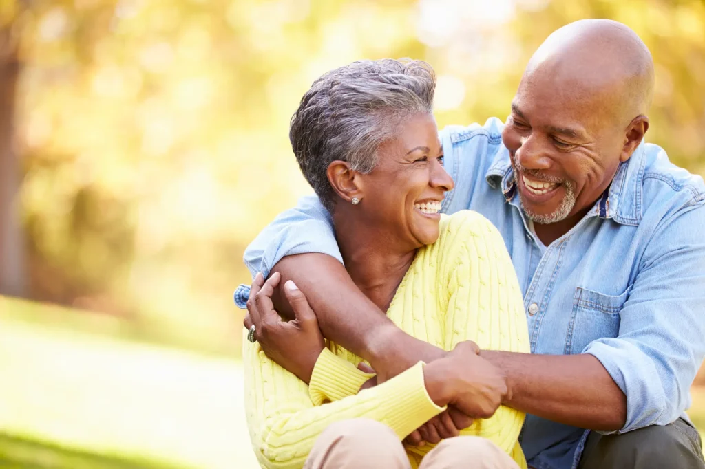 older african-american couple hugging