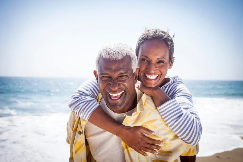 older couple having fun on beach