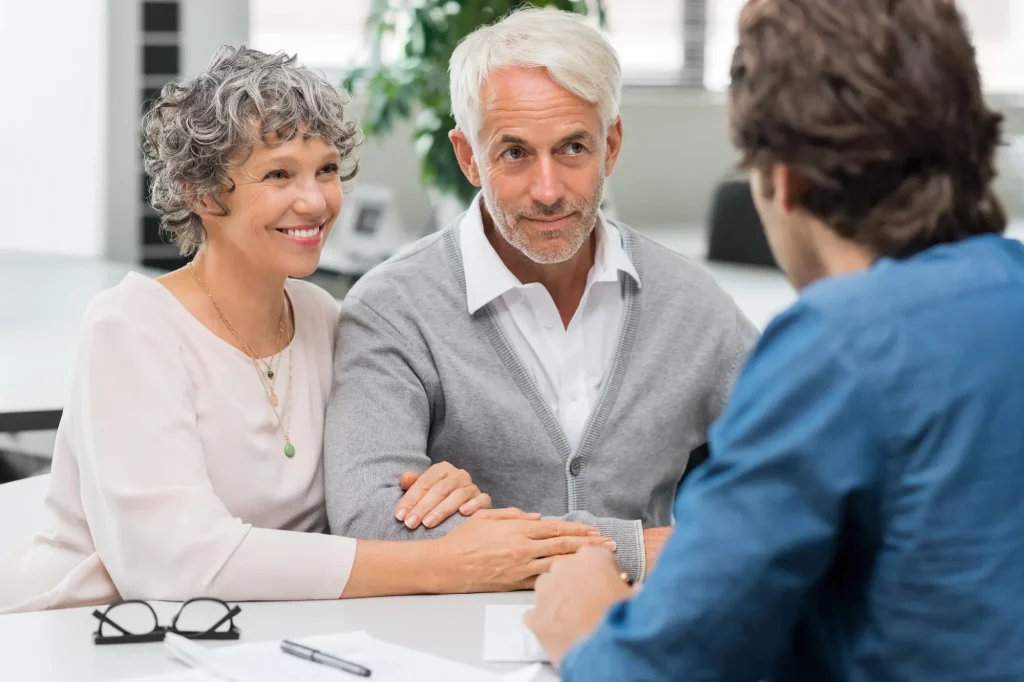 older white couple with lawyer estate planning

