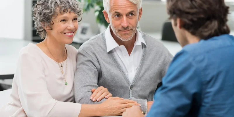 older couple talking with a lawyer