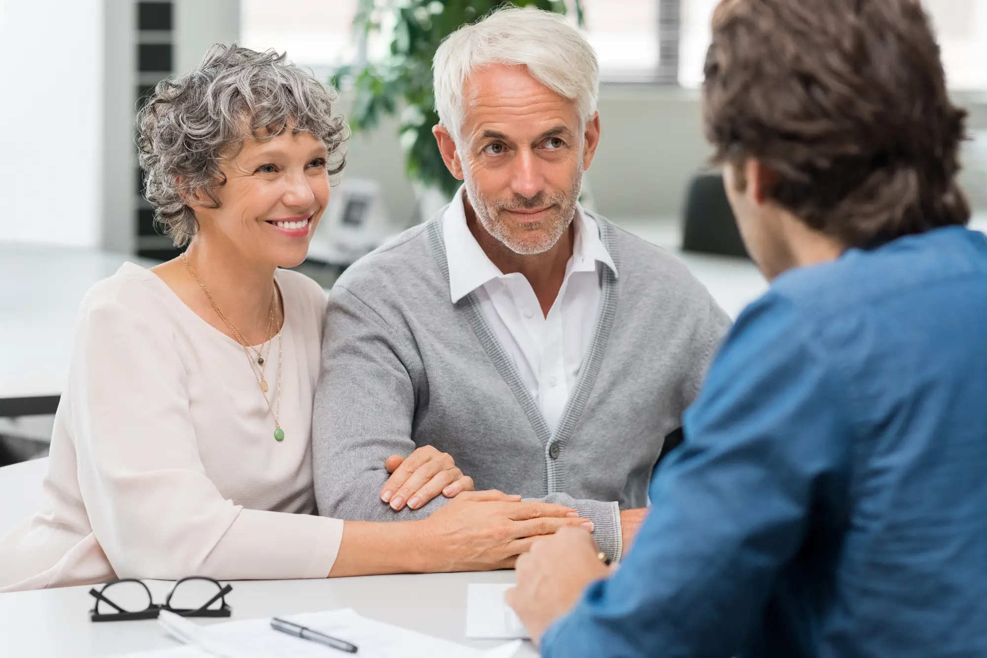older couple talking with a lawyer