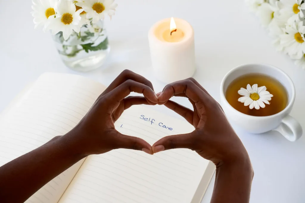 heart hands over journal