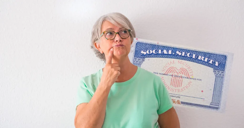senior woman with a thinking face standing in front of a social security card