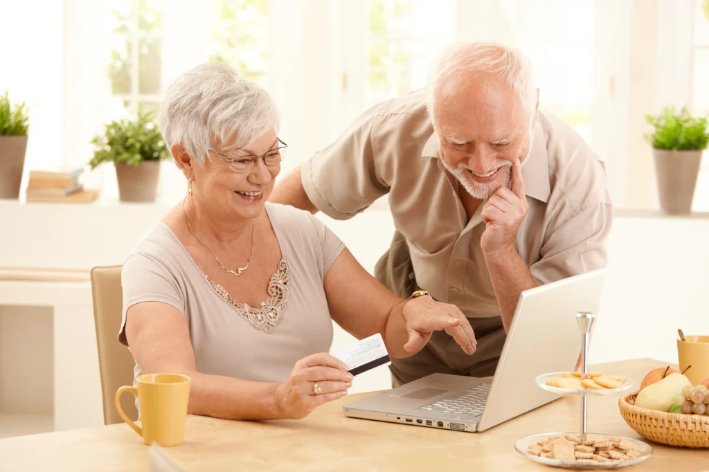 older couple looking at a computer