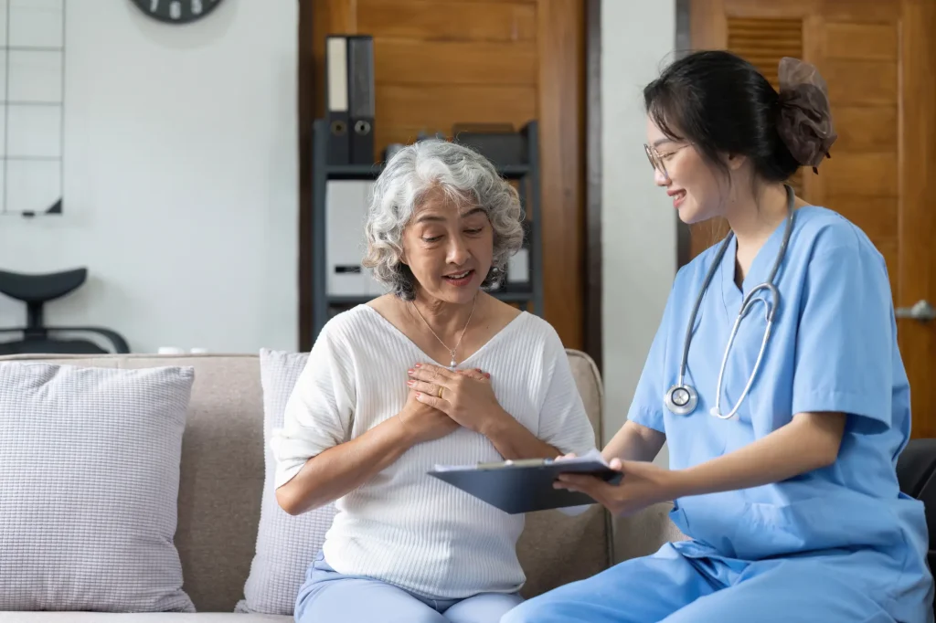 nurse consulting with patient, assisted living
