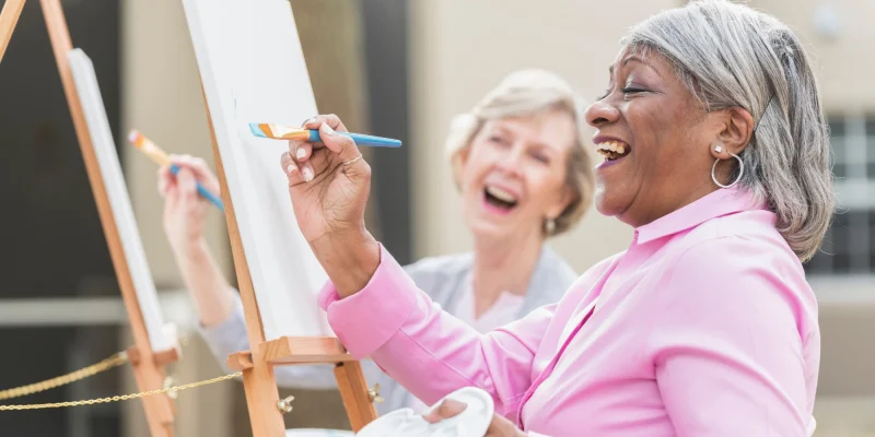 older adults, seniors, having fun painting
