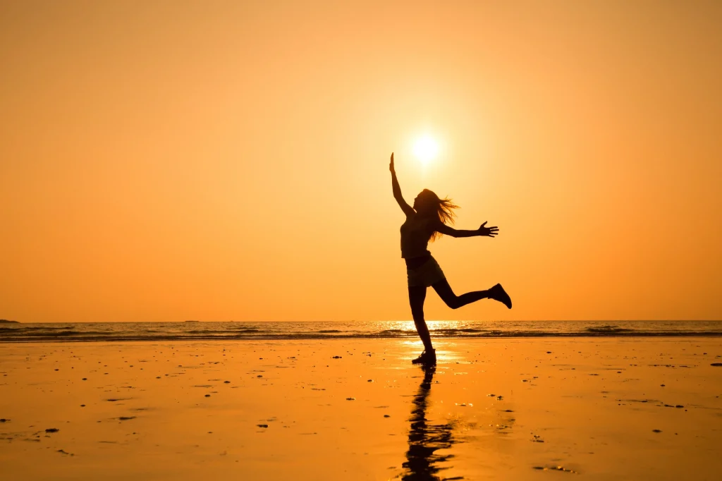 lady dancing on the beach
