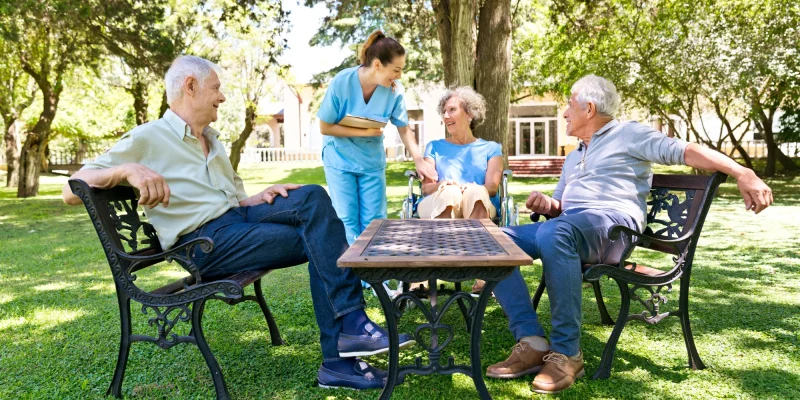assisted living patients outside with nurse