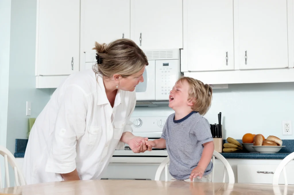 grandma comforting child tantrum