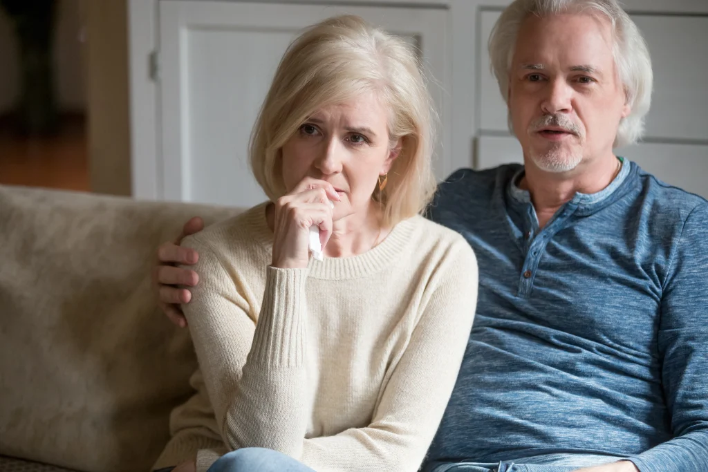 Emotional senior husband and wife