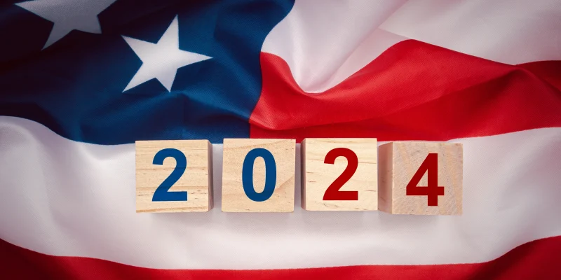 american flag with 2024 blocks on top in blue and red, symbolizing election 2024
