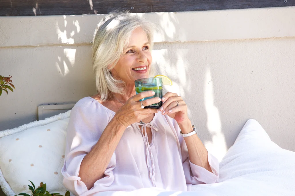 lady sipping water outside