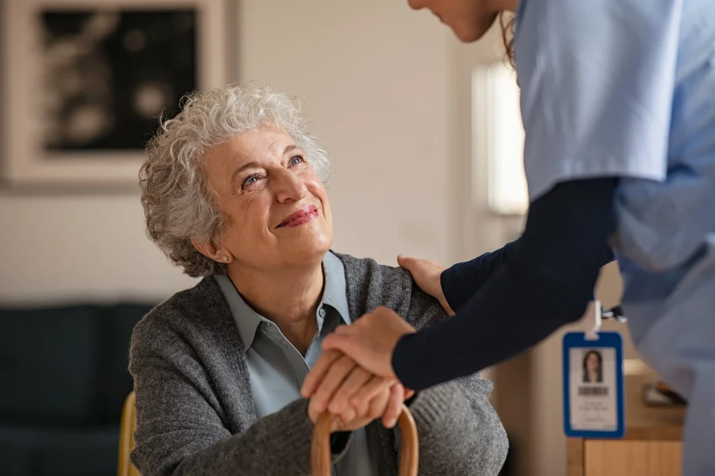 nurse and patient iwth cane