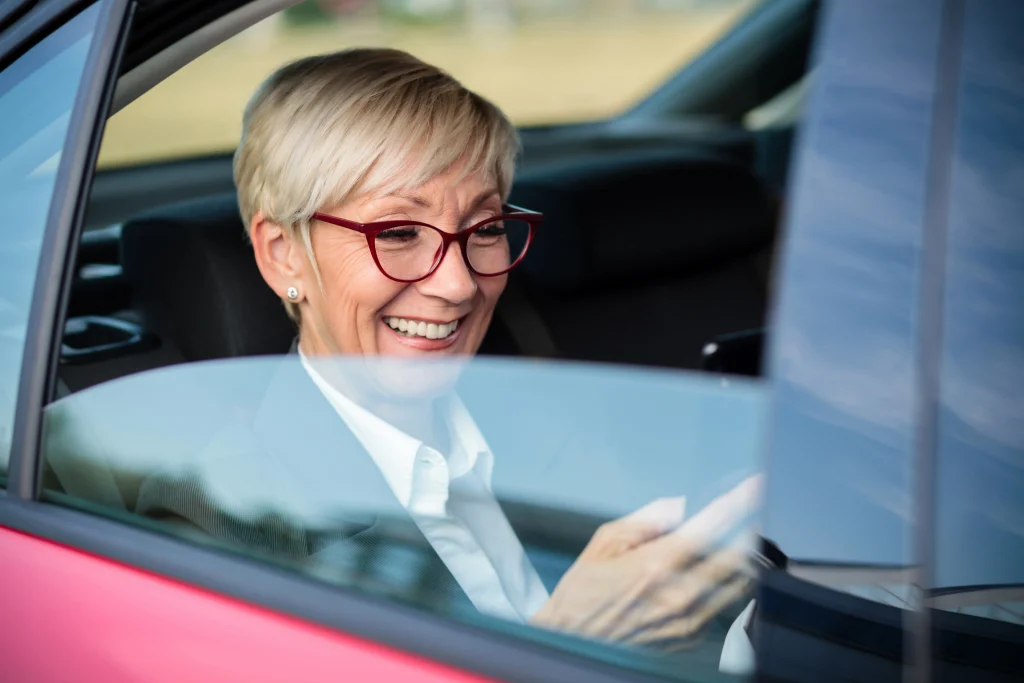 senior woman getting rideshare transportation