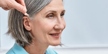 Audien Atom 2 on a senior woman