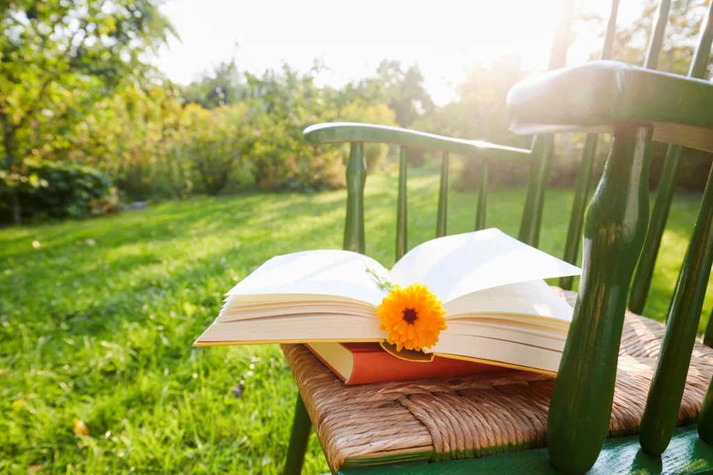 gardening book on a chair with a flower